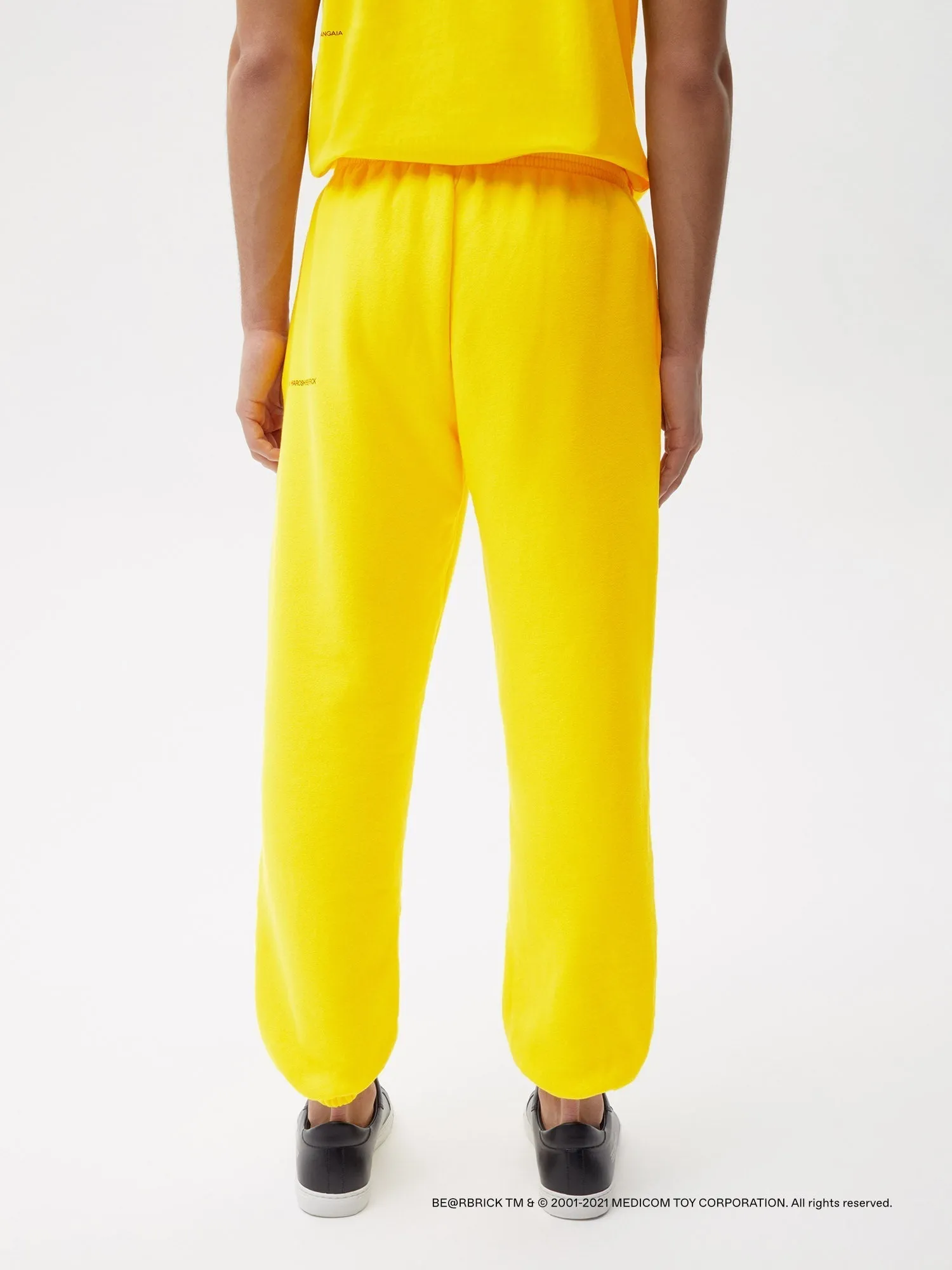 Pangaia x Haroshi BE@RBRICK™ Recycled Cotton Track Pants—saffron yellow